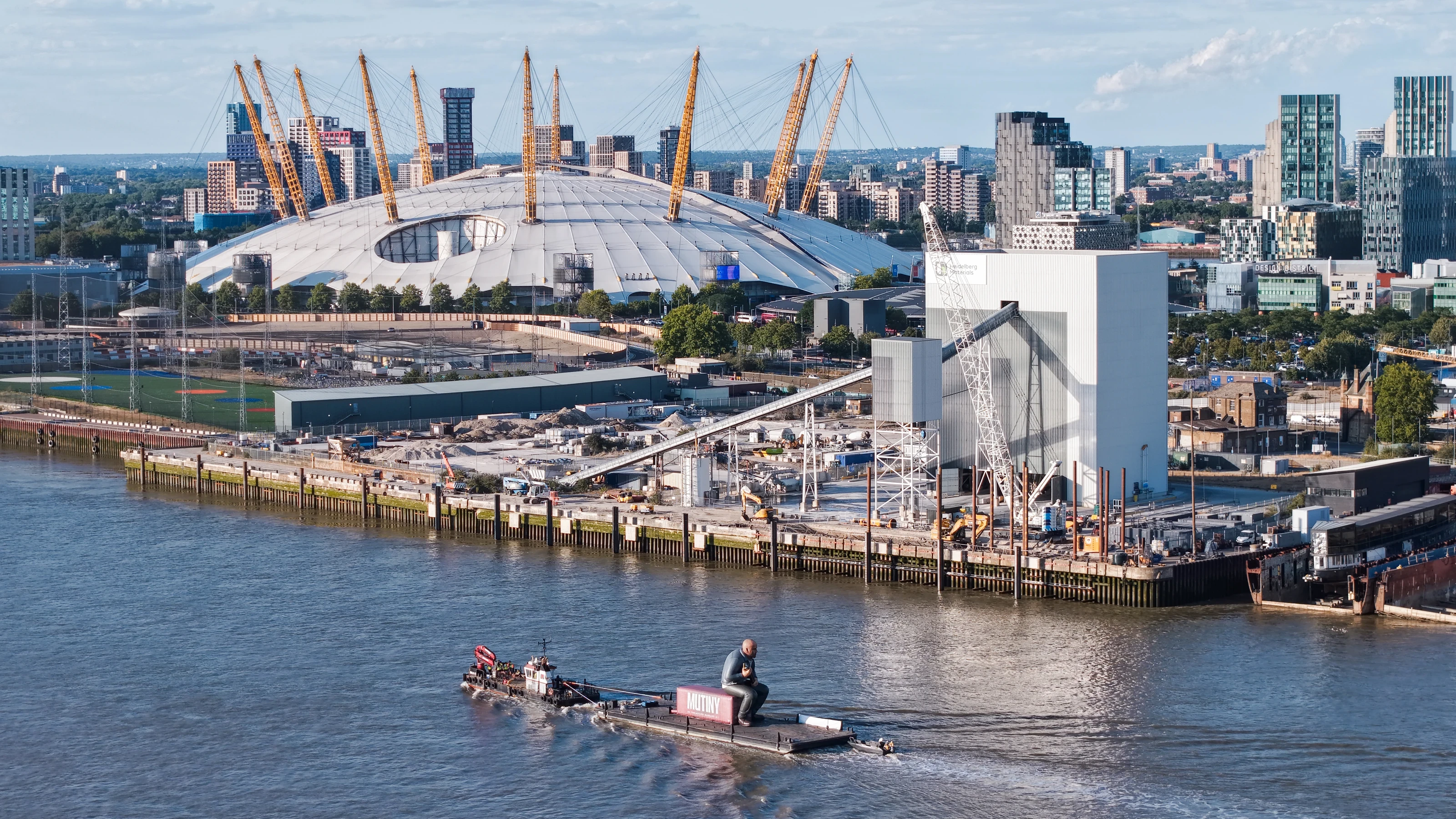 High aerial photograph of the Mutiny Thames brand activation with the O2 arena and the Greenwich Peninsula behind.