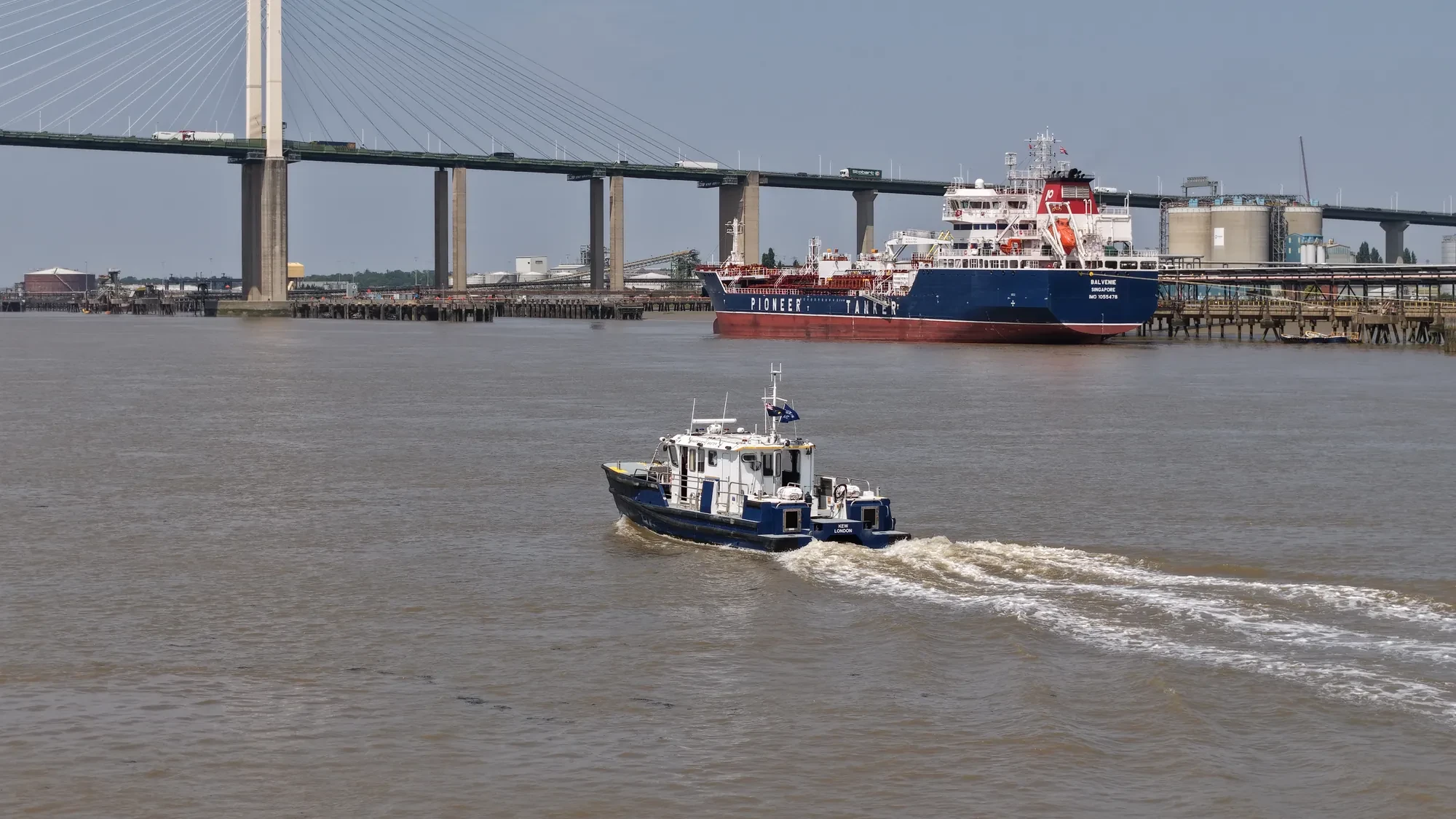 Port of London Authority harbour service launch Kew beneath the Queen Elizabeth II Bridge at the Dartford Crossing, aerial drone photograph
