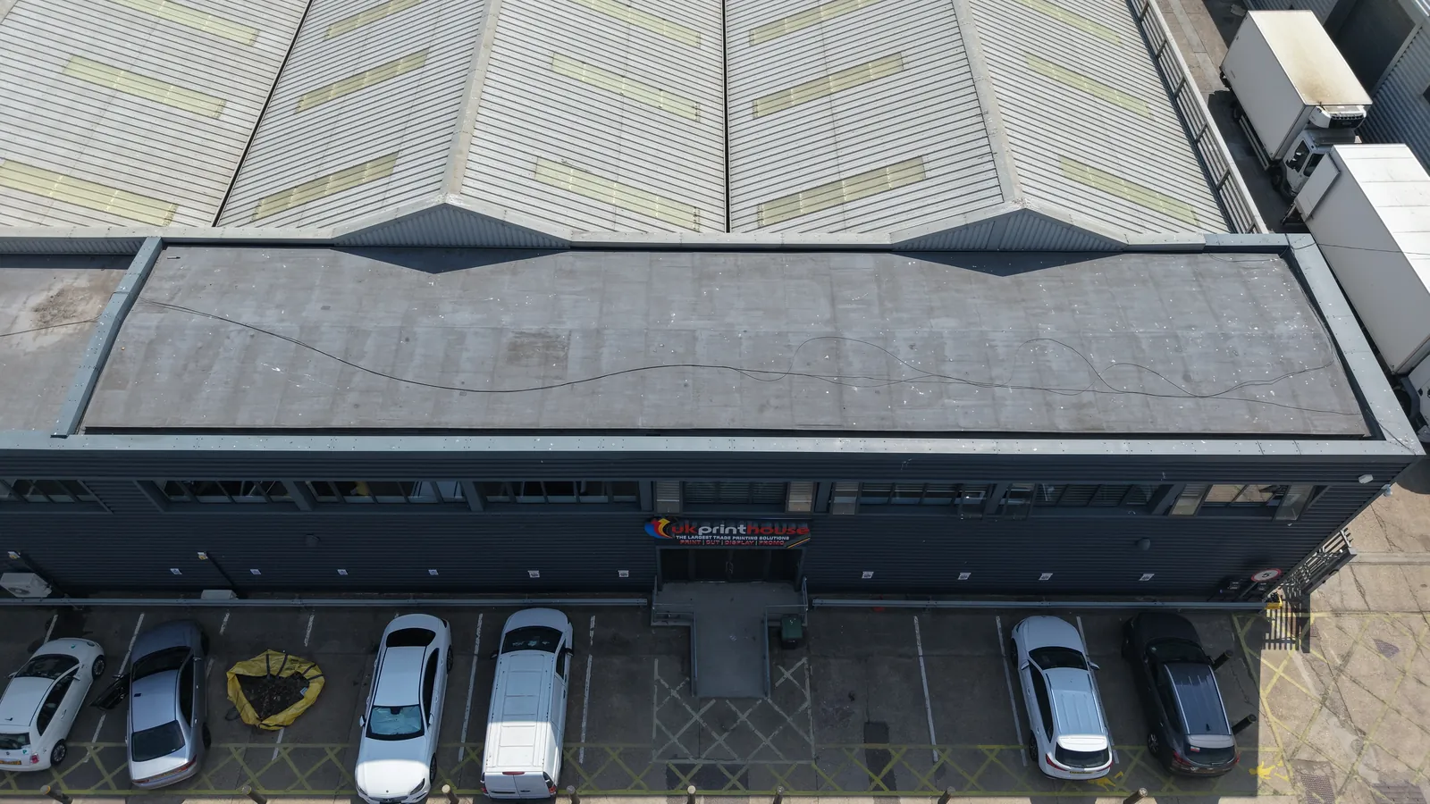 Aerial roof and facade condition survey of a commercial industrial unit in London