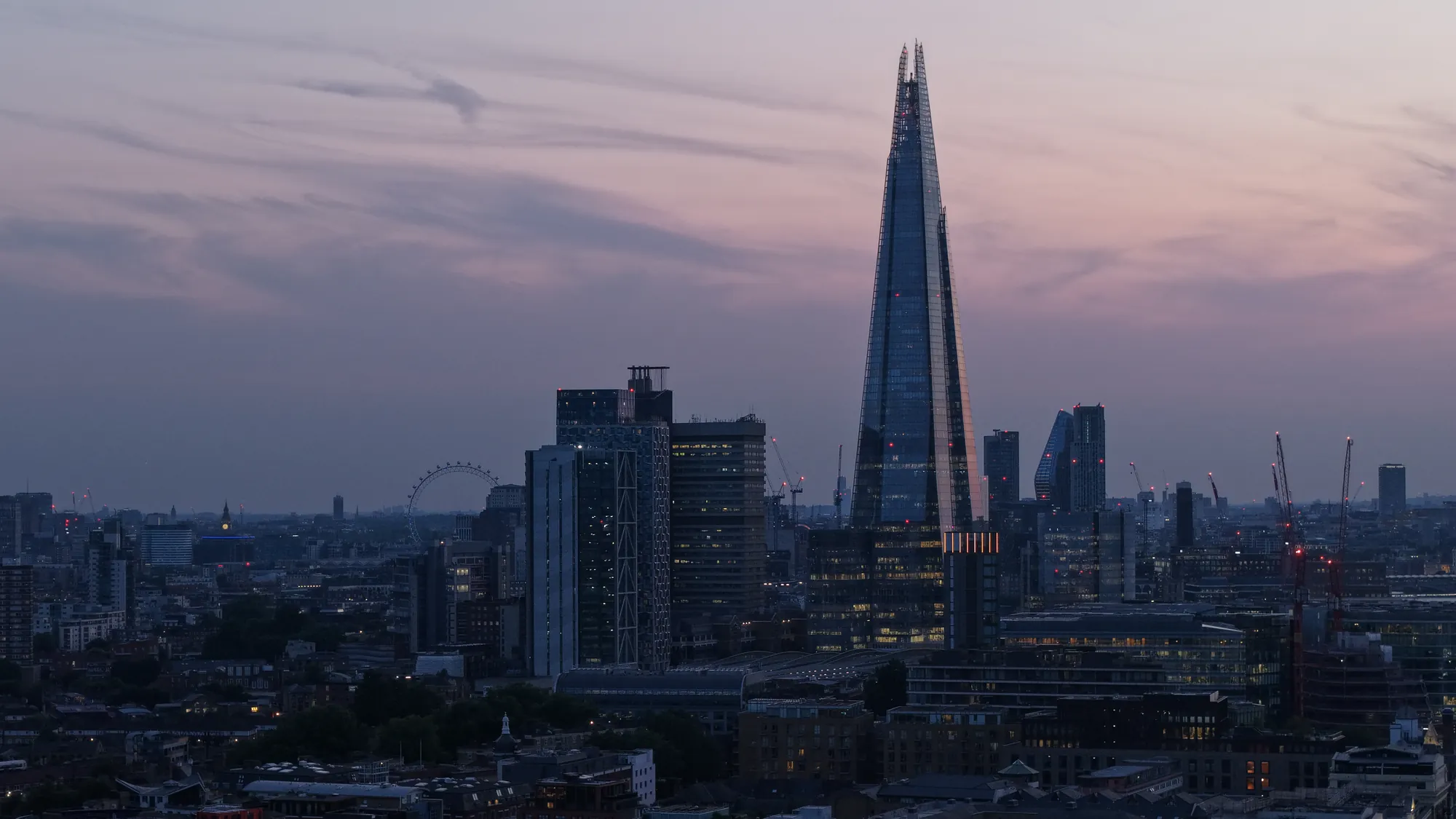 Twilight aerial photograph of the London skyline with The Shard and the City for premium property marketing