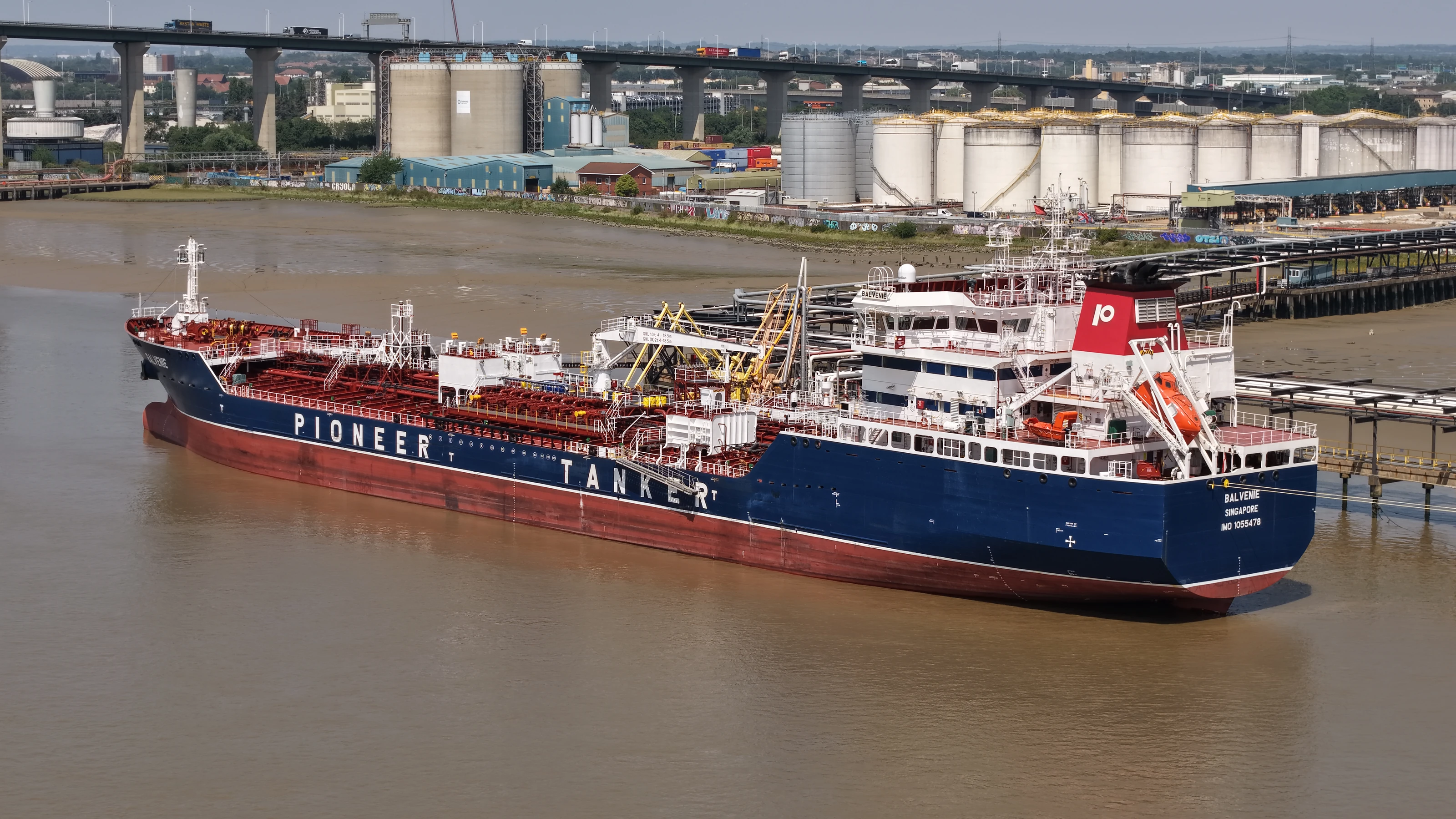The Singapore registered tanker Balvenie berthed on the lower Thames with the terminal storage tanks beyond.