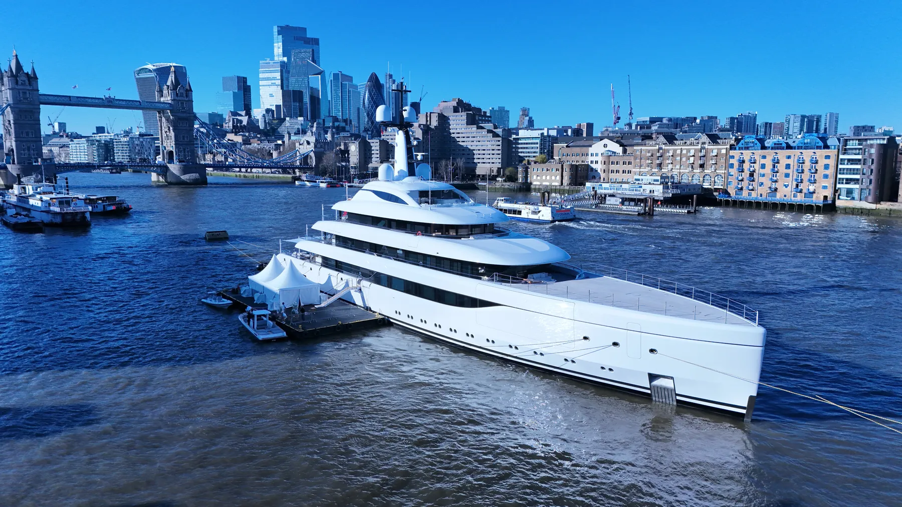 Aerial photograph of the Lürssen superyacht Odisea moored on the River Thames in central London.