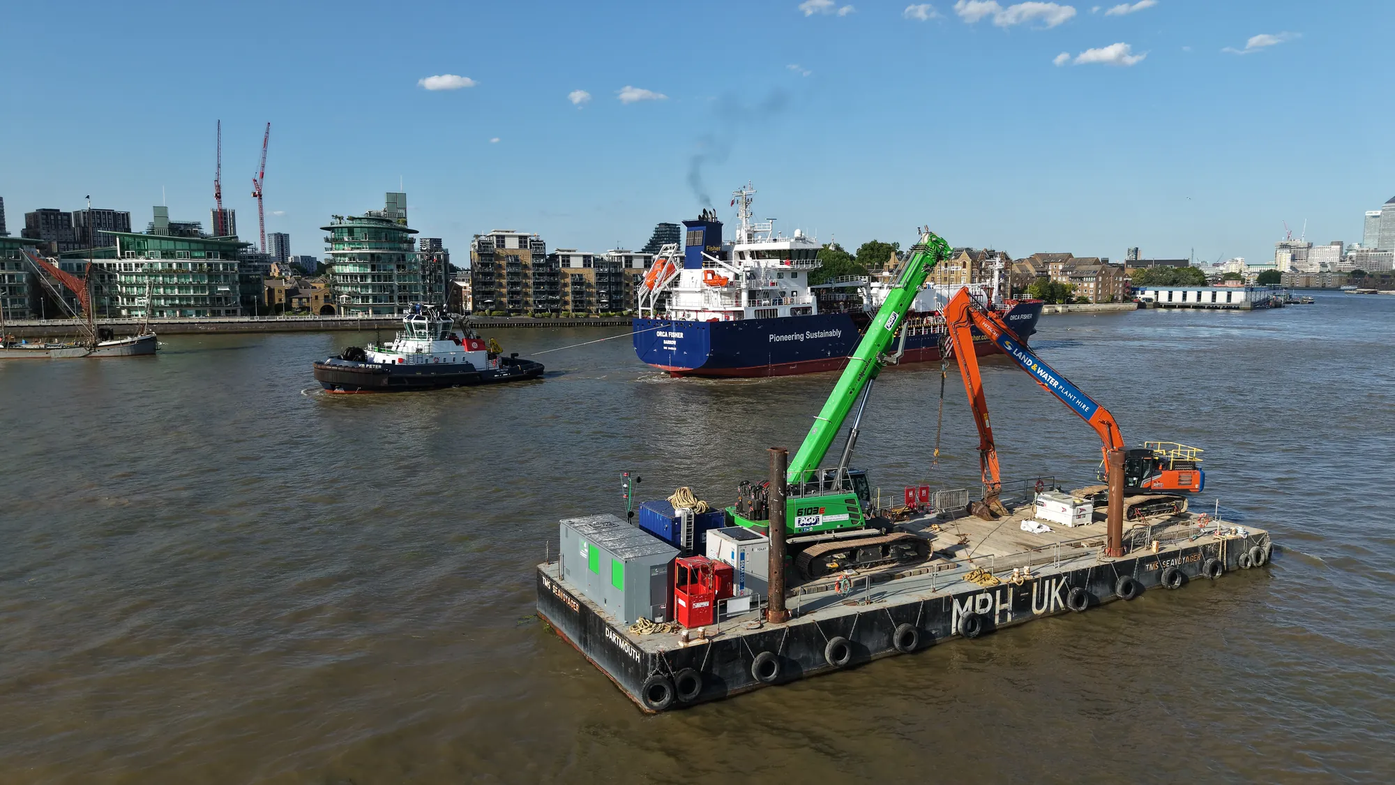 MPH UK spud-leg pontoon TMS Seavoyager with a Land and Water excavator carrying out marine works on the River Thames.